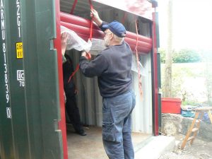 Strapping up the roller part of the door