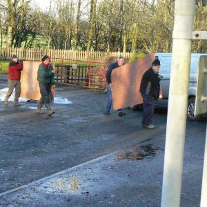 Unloading plywood for the floor